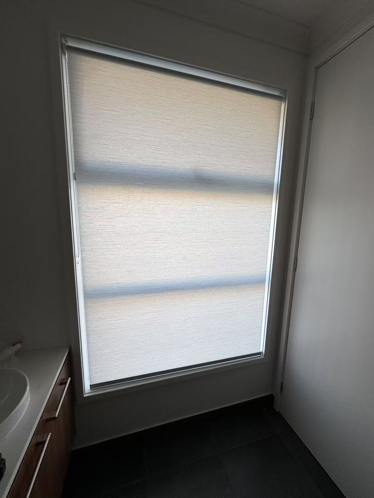 White light filtering privacy roller blind installed for one window