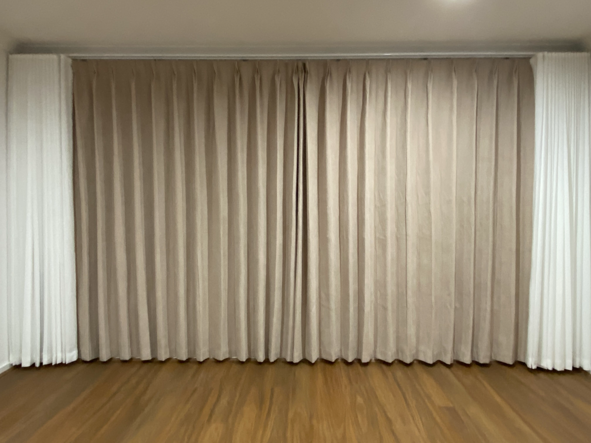S-fold transparent sheer with pinch blockout curtain installed for the bedroom window