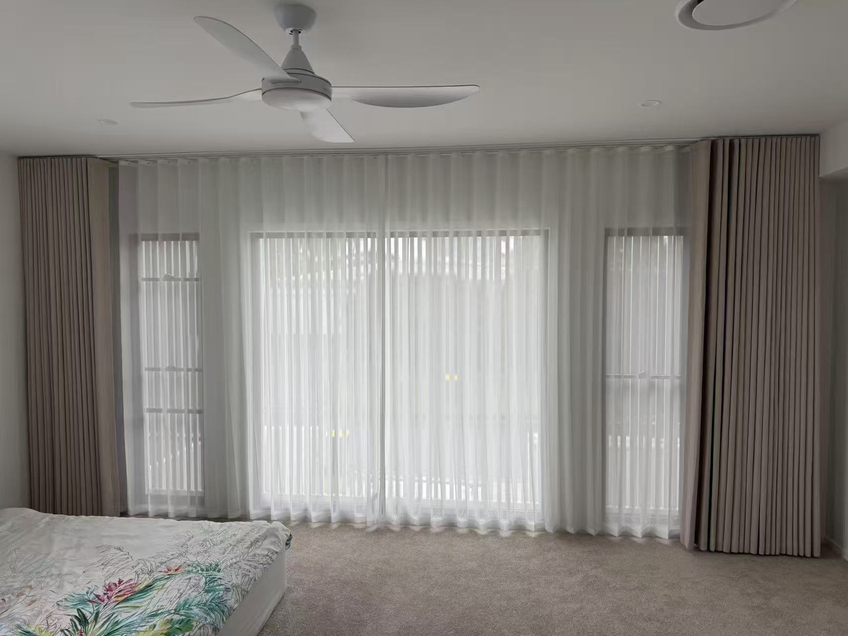 Full wall S-fold curtain with S-fold transparent sheer installed in master bedroom