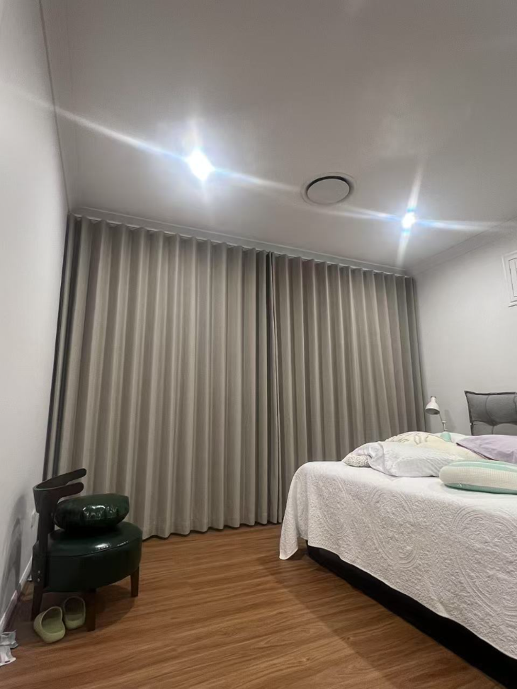 S-fold blockout brown curtain installed in the bedroom