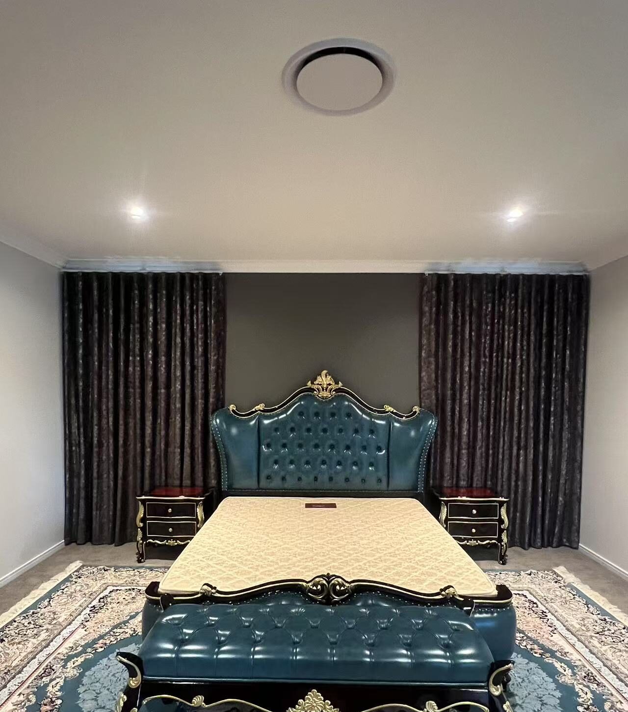 S-fold blockout curtain installed between bed in the master bedroom