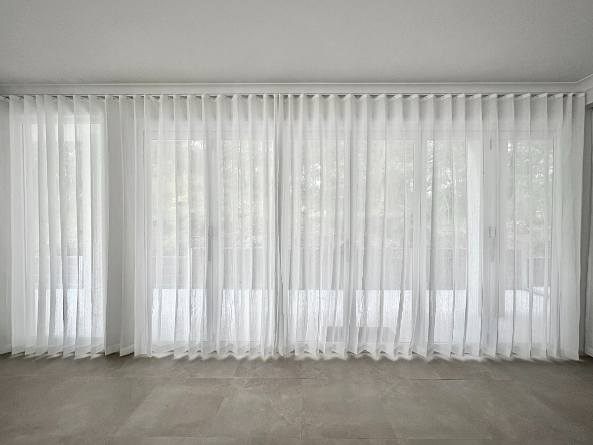 S-fold transparent sheer installed for sliding door and window in living area