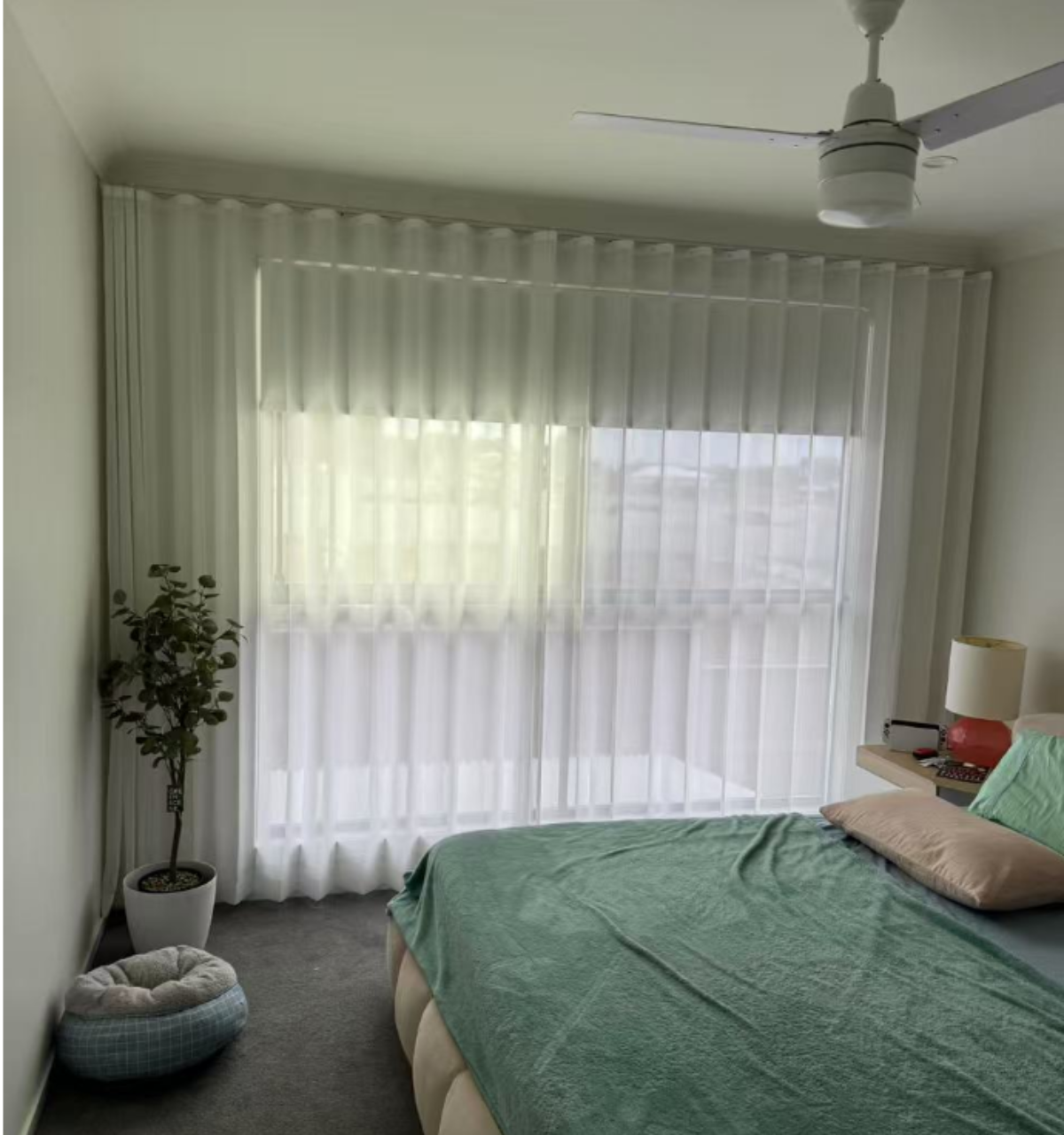 S-fold transparent sheer with grey blockout curtain installed for bedroom window