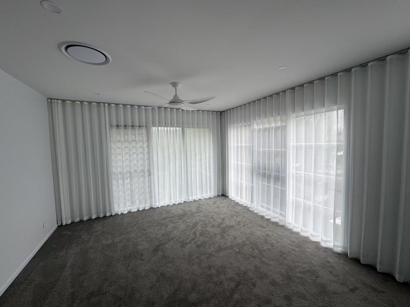 S-fold transparent sheers installed for two windows in bedroom 1