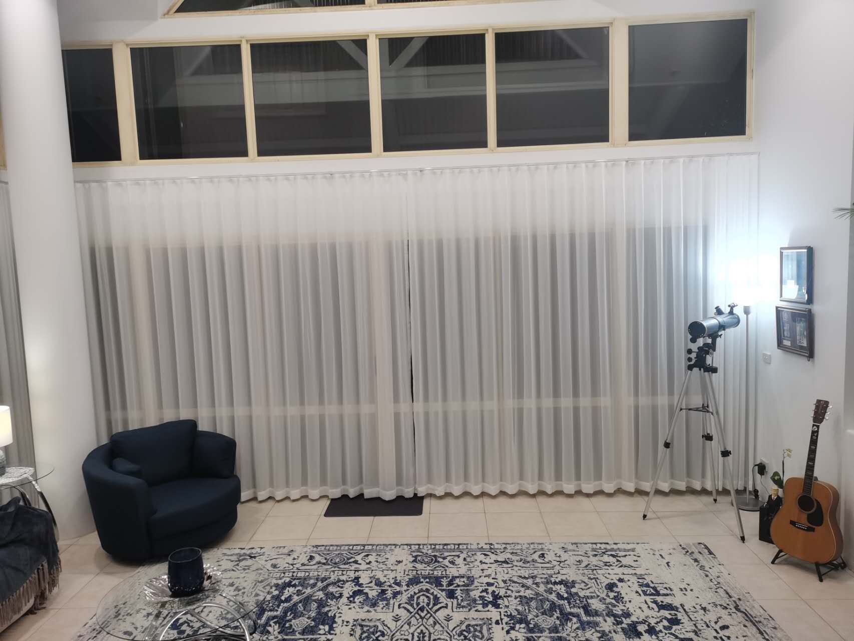 Installed S-fold transparent sheer for double open in the living room