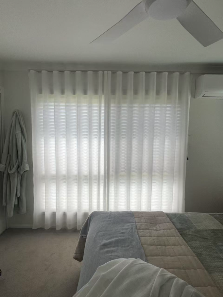 S-fold transparent sheer installed in the bedroom
