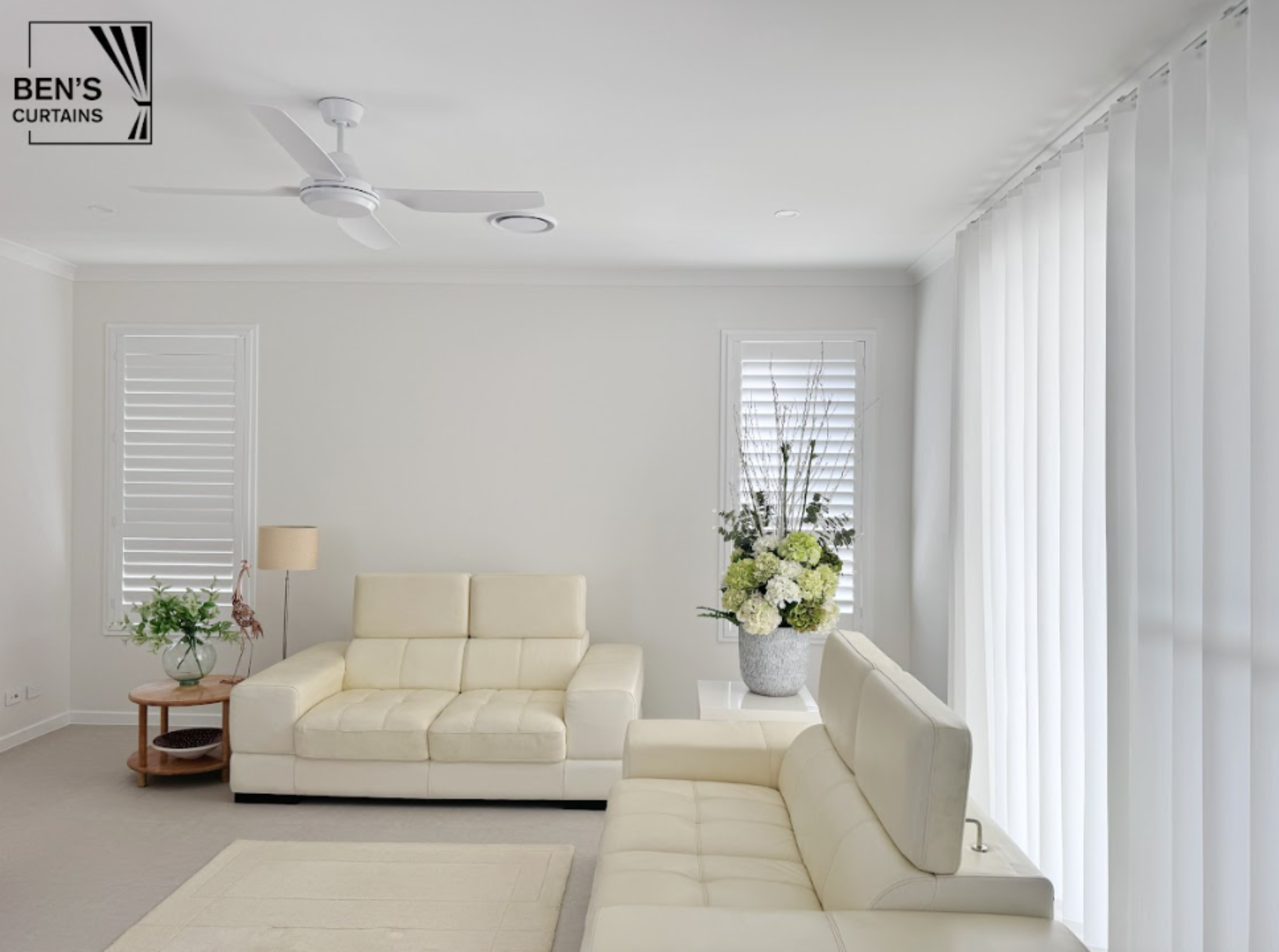 PVC plantation shutter and S-fold sheer installed in living room