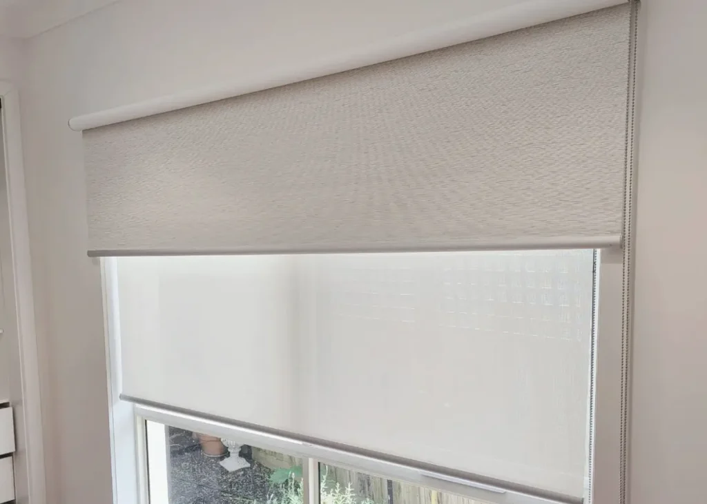 Custom roller blind fitted neatly on a living room window