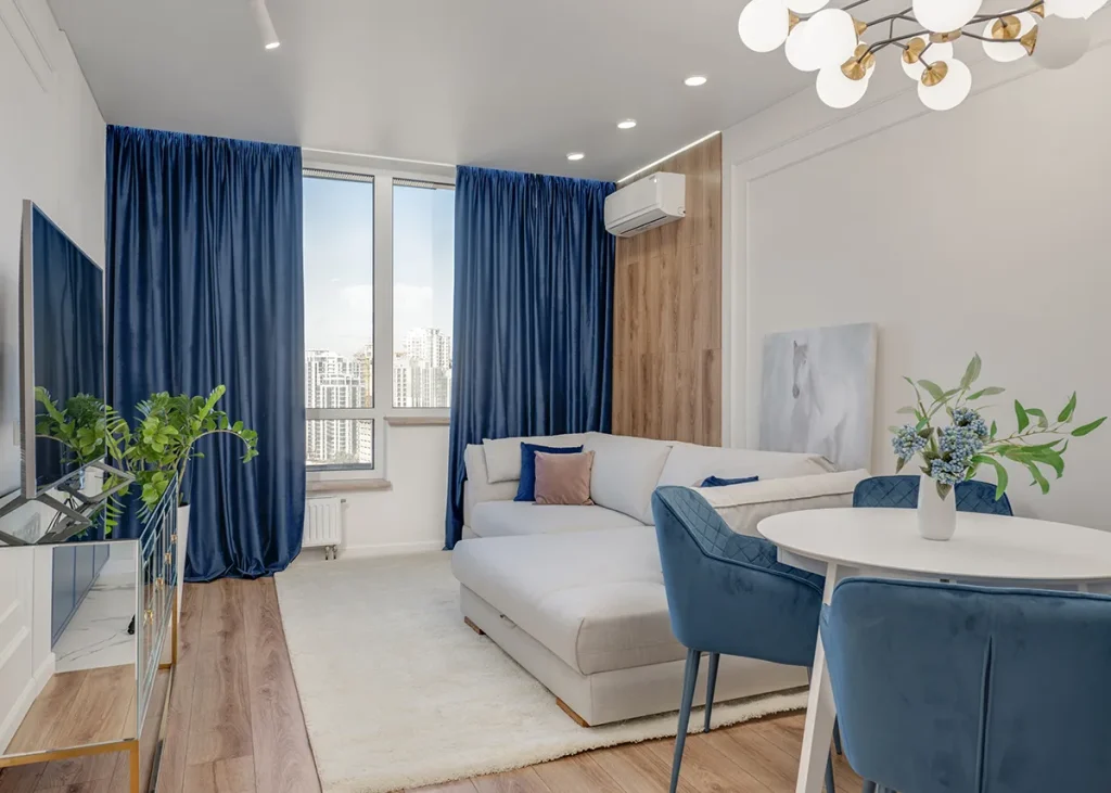 Deep-toned heavyweight blockout drapes framing a bedroom window