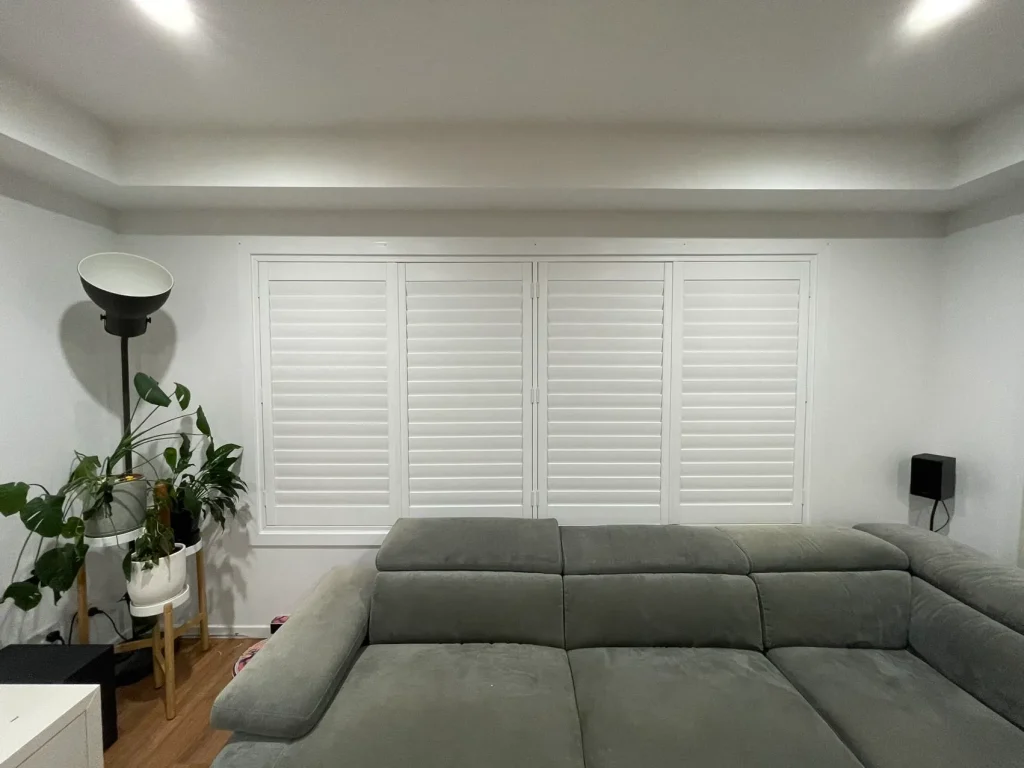 White PVC shutters elegantly installed in a living room