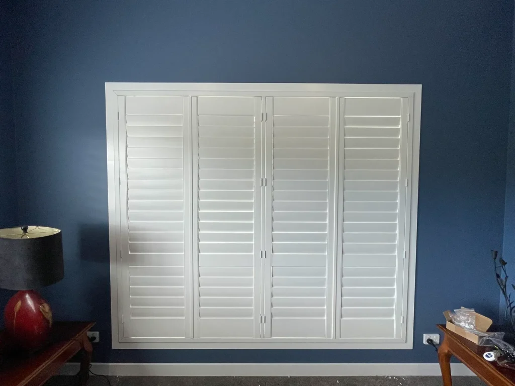 White PVC shutters elegantly installed in a dining room