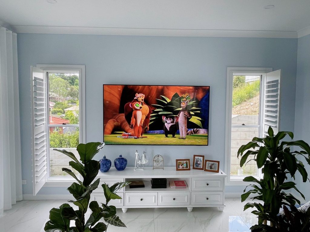 White PVC shutters elegantly installed in a living room.