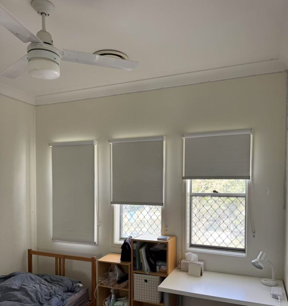 grey blockout roller blinds used reverse installation way for bedroom windows