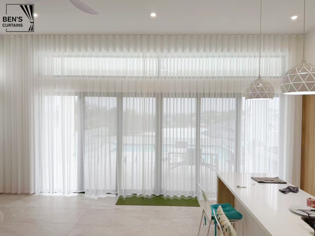 high ceiling mount see through or transparency s fold sheer installed in a luxury living room with city view