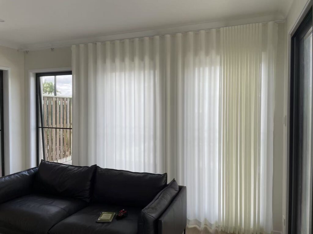 off white s fold privacy sheer installed in a living room