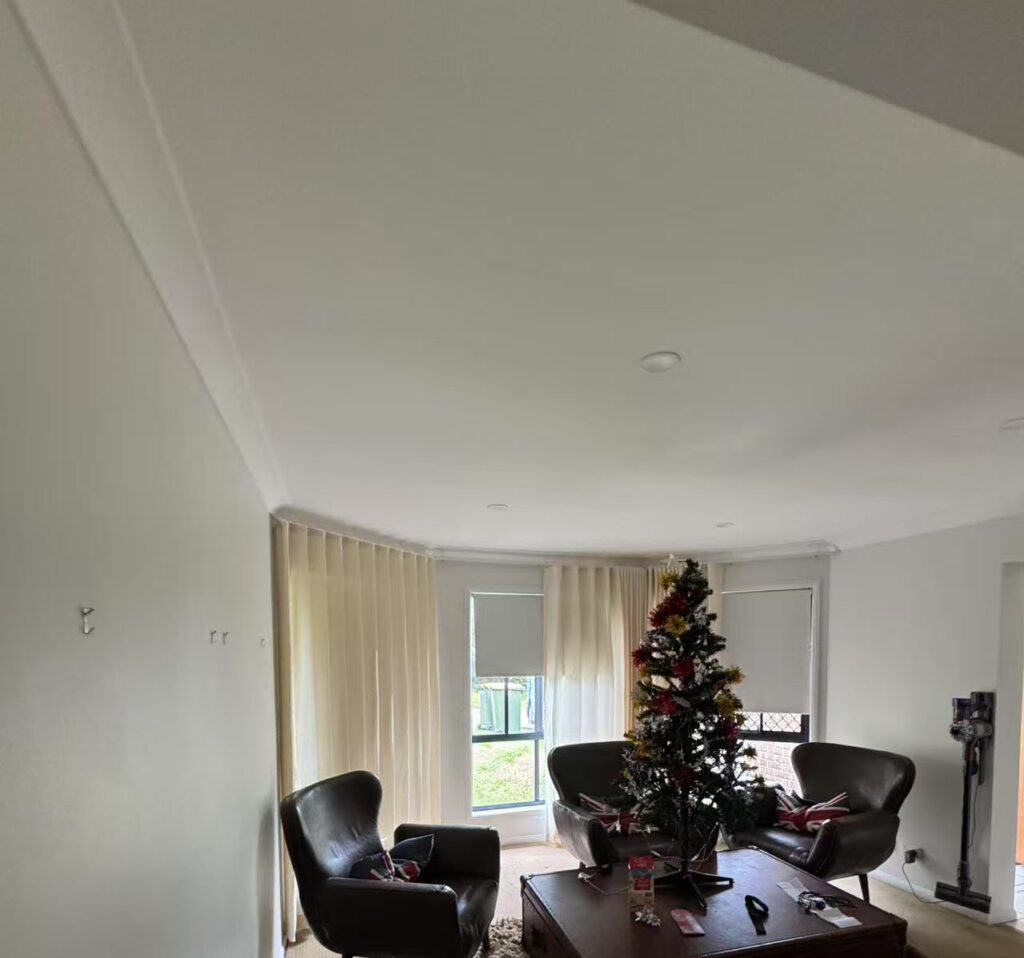 s fold sheer with grey blockout roller blinds installed for by windows in activity area