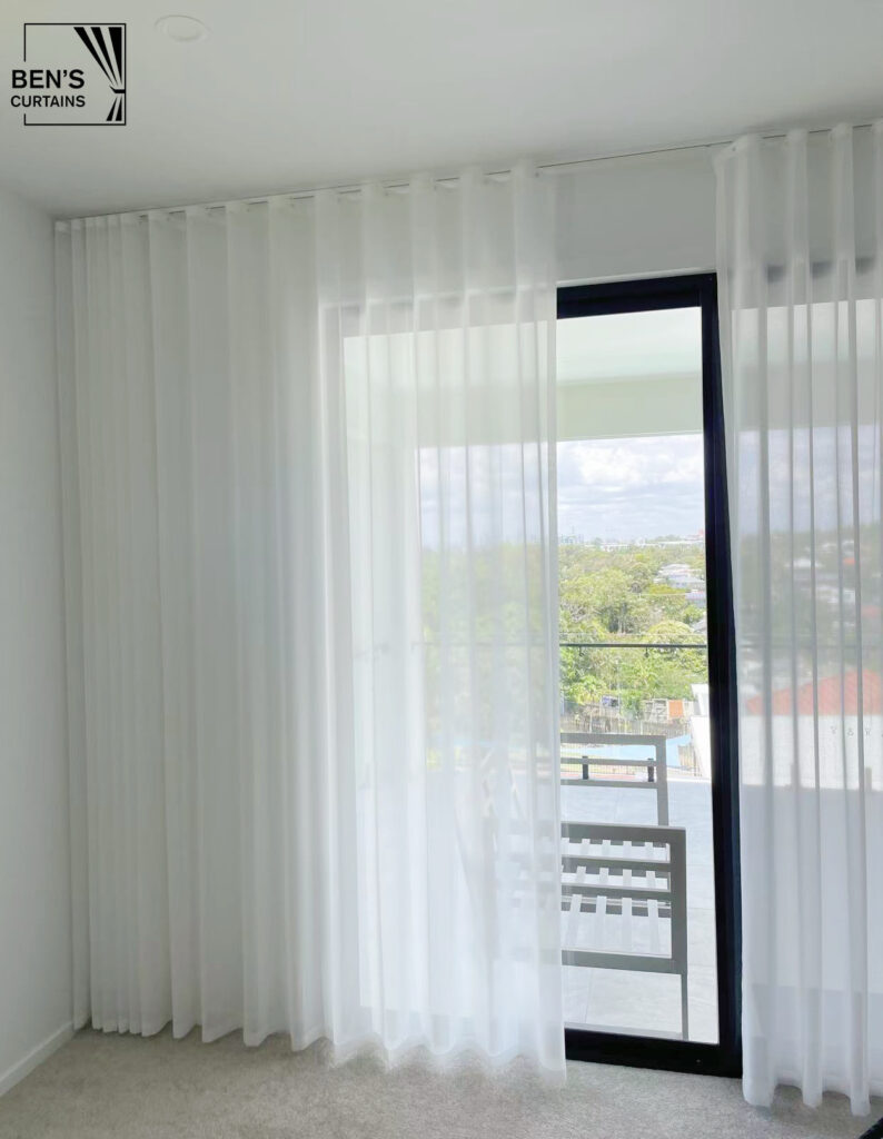 s fold transparency sheer installed in a rumpus sliding window sheer see through to city view