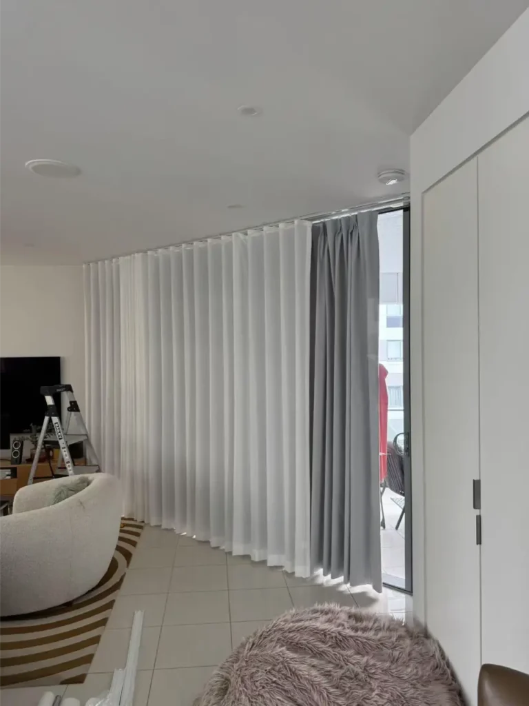 S-fold sheer with pinch curtain in living