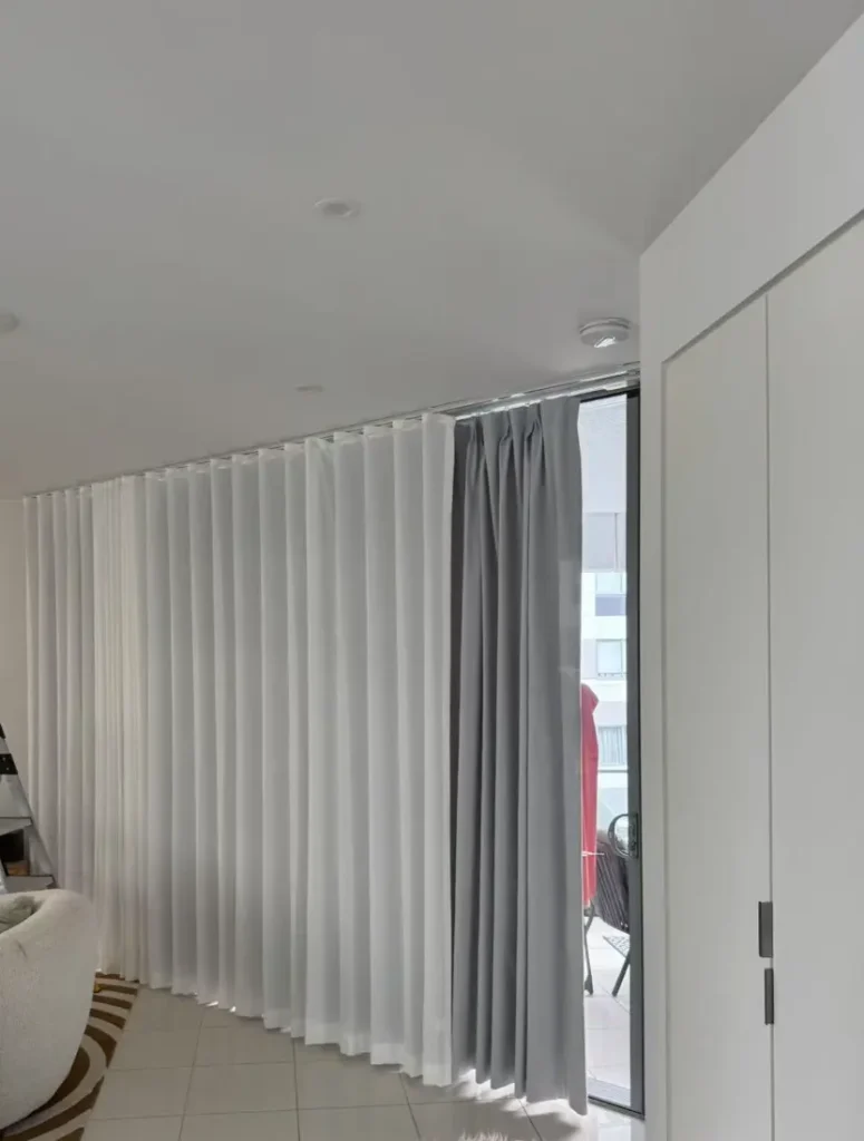 S-fold sheer with pinch curtain in living