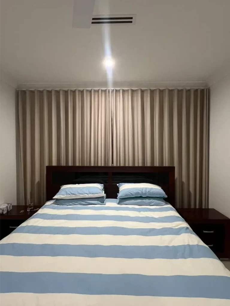 bedroom rol;;er blinds with shher in front