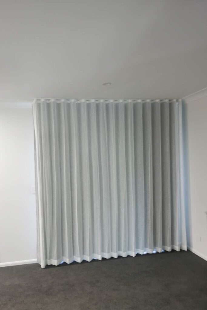 s fold sheer with pinch blockout curtain installed for one window